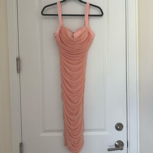 Salmon/ pink colored bodycon dress. New with tags!
